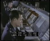 [1972 - Color, Cold War:SAC Information Film]nGrain fields in breeze, Nebraska prairie; river valleybombs releasedhitting factory w/ explosion.Explosions of bomb run seen from ground.n00:01:11t09:15:46Heavy black smoke roiling upfighting oil storage tank fireview from nose of plane.Nuclear bomb falling (?).Color test footageidentification checked against computer printout by Black officerpast other check points.n00:03:42t09:18:17High angle of long console w/ men seated; w