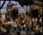 [WWII - Color, 1945:Germany:USAAF Planes Bombing Germany; Ohrdruf AV bombs fallair crew into truck; bomb loadingcrew into truck; out to B-26 airplane; flash slate:22Apr45.n00:02:38t12:02:38Crew enter aircraft; bombardier adjusts sights.n00:03:09t12:03:09Pilottruck leaves airfield.n00:04:08t12:04:08Small truck pulling trailers w/ bombsn00:09:49t12:09:49MCU chalking Happy Birthday Hoimann!From Duffy’s Tavern.n00:10:06t12:10:06Interior:Navigator into seat next to p