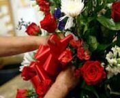 Joe Aguilar of Dallas House of Flowers discusses creating floral arrangements used in memorials and funerals for the five Dallas police officers who were killed last week. (DMN-Video/editing: G.J. McCarthy)