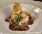 Chef Scott Boswell’s turn on New Orleans’s famous Bananas Foster stacks spiced French toast with ice cream. The Bananas Foster sauce is poured over the dessert and garnished with spiced candied walnuts, fried plantain, and mint. The addition of cayenne pepper gives these nuts a little bite. The walnuts could be made separately and given as holiday gifts. Save some time at the last minute by softening the ice cream earlier in the day and forming 8 quenelles, then putting the quenelles back in