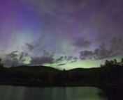 The Aurora Borealis in New Hampshire on June 22, 2015.nnI was hearing rumors of increased Aurora chances and packed my camera gear around 10PM. Having never seen the northern lights before, I thought the faintly illuminated glow I saw was moonlight on the clouds but then I took a photo. “Wow, this is amazing!” Purple and pink pillars of light rose out a soft green haze. Meanwhile, hundreds of fireflies were dancing all around me — it was like being at a noiseless fireworks show. Multiple t