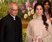 Juhi Chawla in layered Sabyasachi anarkali and husband Jay Mehta make a grand entry to Sonam and Anand’s wedding reception #ThrowbackJuhi looked graceful and elegant in a baby pink, layered anarkali by Sabyasachi that she paired with matching tassel detail dupatta. She added extra bling to her outfit with a shimmery silver clutch. Side-swept curls, simple makeup and a pair of dangling earrings finished off her look. Mr Jay Mehta went with a classic piece of all black crisp suit. Sonam Kapoor a
