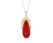 https://www.ross-simons.com/993940.htmlnnC. 1990. Its known that fiery red makes an unforgettable statement, so let this Estate collection necklace help you to stand out! A sizable 26x11mm pear-shaped red coral cabochon centers the pendant beneath a gleaming sash of 10kt rose gold sparked with diamond accents. Suspends from a 14kt rose gold cable chain. Lobster clasp, red coral pendant necklace. Exclusive, one-of-a-kind Estate Jewelry.