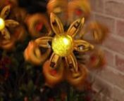 Mesmerising jewelled solar wind spinner.nnTransform your garden into a dazzling display of golden autumn colours! This striking centrepiece adds movement, light and a warm glow to dull corners, reflecting the sun by day and illuminating your garden at night. Solar-powered with zero running costs.