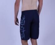Model wearing Salt Life Stealth Bomberz Boardshorts to show fit