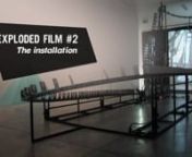 Exploded Film offers an exploded view on film. The installation consists of a rollercoaster shaped track that represents the typical story plot of a movie. A camera follows this track up and down, producing a film that is simultaneously projected in the installation set up. Well-chosen key moments of the story plot are placed on the track, and when the camera passes them, short film sequences are injected into the projected film.nIn this installation the spectator gains insight in the invisible