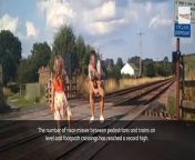 Shocking photos and videos show reckless parents risking their children’s lives by encouraging them to play and pose for selfies on busy railway lines.&#60;br/&#62;&#60;br/&#62;In one picture taken from security cameras at an unnamed crossing, a father and two boys appear to be taking photographs of an approaching train.&#60;br/&#62;&#60;br/&#62;The youngest boy even has a tripod set up on the track while the man stares down the lens of his camera.&#60;br/&#62;&#60;br/&#62;Another image shows a young girl posing on the live train tracks while her father takes a snap of her.