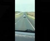 Eyewitness video captures a daring escape bid along a Texas highway Wednesday. Authorities say a man being transported to jail kicked out a back window and climbed on top of the patrol car as it traveled down the highway.