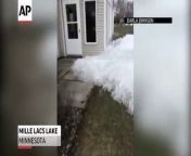 Amateur video captures a wave of ice blanketing backyards and threatening houses in the Mille Lacs Lake area of Minnesota.