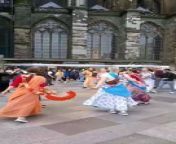 Beautiful women dancing in front of the cathedral in Cologne from beautiful salwar in ass