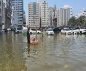 Sharjah residents use inflatables to wade through the water from dj using youtube