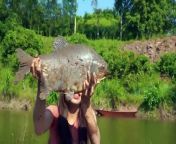 Beautiful Girl Catches a fish originating from the Amazon Forest