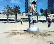 Fact: stunting off a buried exercise ball doesn&#39;t get the ladies. The second guy takes the direct approach and ends up directly in the sand.